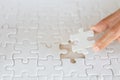 Hand put the last piece of jigsaw puzzle to complete the mission, Business solutions, success and strategy concept Royalty Free Stock Photo