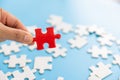 Hand put the last piece of jigsaw puzzle to complete the mission, Business solutions, success and strategy concept Royalty Free Stock Photo