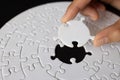 Hand put the last piece of jigsaw puzzle to complete the mission, Business solutions, success and strategy concept, The solution Royalty Free Stock Photo