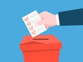 Hand put paper with a sign in a ballot box. Political election Royalty Free Stock Photo