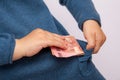 Hand puts ten euro banknote in his pocket Royalty Free Stock Photo