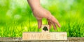 Hand puts the word environment together with wooden cubes Royalty Free Stock Photo