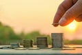 Hand putting coin on coins stack Royalty Free Stock Photo