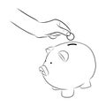 Hand putting coins/money into saving piggy bank Royalty Free Stock Photo