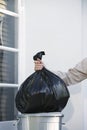 Hand Putting Garbage Bag Into Trash Can Royalty Free Stock Photo