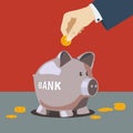 Hand is putting money into piggy bank. Royalty Free Stock Photo