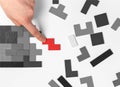 Hand putting outstanding tetris puzzle piece. Logical thinking, problem solving concept. Important missing element Royalty Free Stock Photo