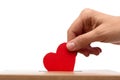 hand putting red heart into charity donation box Royalty Free Stock Photo