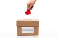 hand putting red heart into charity donation box Royalty Free Stock Photo