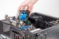 hand putting in or removing pc internals while maintenance personal computer hardware with selective focus