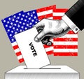 Hand putting voting paper in the ballot box on USA flag background Royalty Free Stock Photo