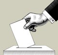 Hand putting voting paper in the ballot box Royalty Free Stock Photo