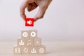 Hand putting wood cube block on top pyramid wooden there are various symbols on the audio