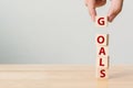 Hand putting wood cube with word GOALS Royalty Free Stock Photo