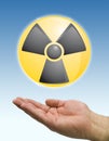 Hand and radioactive icon