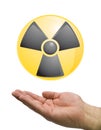 Hand and radioactive logo