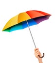 Hand with a rainbow umbrella.