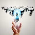 Hand reach 3d light bulb of leadership