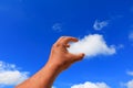 Hand reach out so it the on blue sky background Royalty Free Stock Photo