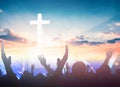 Worship and praise concept: christian people hand rising on sunset background Royalty Free Stock Photo