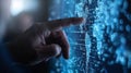 A hand reaches out to touch a digital interface filled with data and code. The image represents technology, innovation, and the Royalty Free Stock Photo