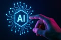 Futuristic hand interacting with glowing AI symbol against a dark background Royalty Free Stock Photo