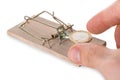 Hand Reaching Coin On Mousetrap