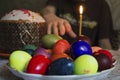 Hand reaching for Easter eggs
