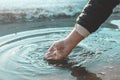 Hand reaching for fresh water