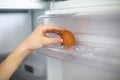 Hand Reaching for the Last Egg in the Refrigerator Royalty Free Stock Photo