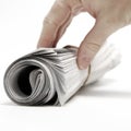 Hand Reaching for Paper Newspaper Rolled Up Royalty Free Stock Photo