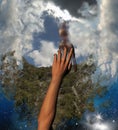 Hand Reaching for Safety Help in Clouds Royalty Free Stock Photo