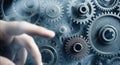 Hand Reaching Toward Interlocking Metal Gears Royalty Free Stock Photo