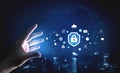 Hand Reaching Towards Digital Security Shield with Icons Representing Technology, Data Protection, and Cloud Computing Royalty Free Stock Photo