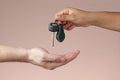 Hand receiving car keys Royalty Free Stock Photo