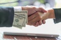 Hand receiving money, US dollars, from business man, Businessman Royalty Free Stock Photo