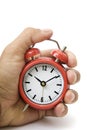 Hand and Red Alarm Clock
