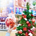 Hand with red ball Christmas tree Royalty Free Stock Photo