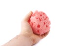 Hand with red bathing sponge isolated over the white background Royalty Free Stock Photo