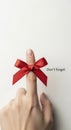 Hand with red bow reminder finger Royalty Free Stock Photo