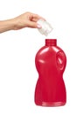 Hand with red detergent bottle, liquid washing soap for textile Royalty Free Stock Photo