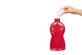 Hand with red detergent bottle, liquid washing soap for textile Royalty Free Stock Photo