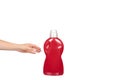 Hand with red detergent bottle, liquid washing soap for textile Royalty Free Stock Photo