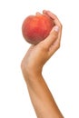 Hand with a red peach Royalty Free Stock Photo