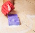 Hand in red rubber glove clean a house floor Royalty Free Stock Photo