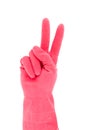 Hand in red rubber glove gesturing victory Royalty Free Stock Photo