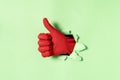 Hand in red rubber glove with thumb up gesture Royalty Free Stock Photo