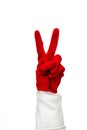 Hand in red rubber glove with two fingers are folded, showing what sign everything is cool. Isolate on a white background.