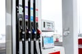 Hand refilling the car with fuel at the refuel station Royalty Free Stock Photo
