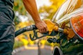 Hand refilling the car with fuel at the refuel station. Generative AI Royalty Free Stock Photo
